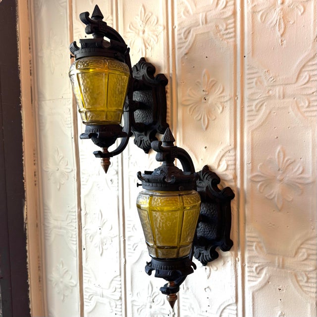 Rare matching set of three antique exterior lanterns, circa 1930–1940, including two wall sconces and one pendant ceiling...