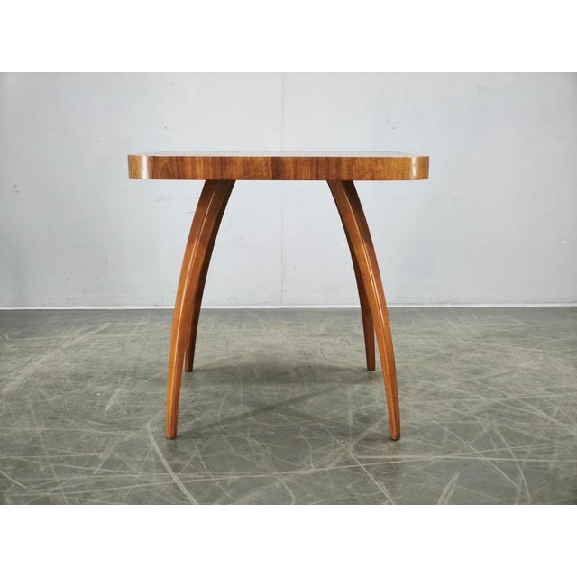 An elegant Spider side table designed by Jindřich Halabala, one of the most influential Czech designers of the twentieth...