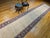 "Refined in its simplicity and rare in form, this vintage Persian Khorassan runner rug from the mid-1900s offers an...
