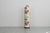 Cylindrical floor lamp from the 70s. The lampshade is continuous to the floor and covered with a floral fabric. The base...
