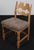 Set of striking dining chairs by Henning Kjærnulf, made of oak and Sahara coloured lambskin. Refreshing design with bold...