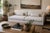 A generously scaled Cisco Home sofa in a soft neutral linen, featuring plush down-filled cushions and a relaxed, modern...