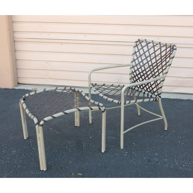 A set of 3 ottomans and 3 arm chairs by Brown Jordon. Brown webbing over putty color aluminum frames. Each labeled "Brown...