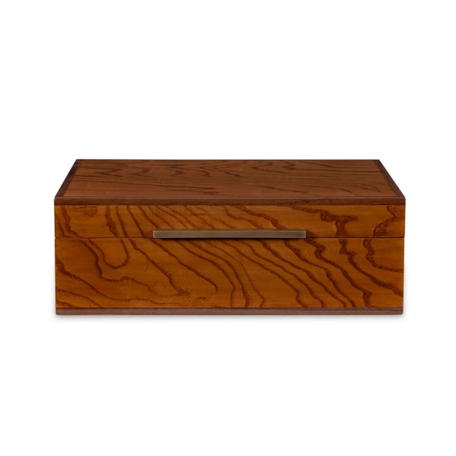 Walnut and brass box with custom hinges and a felt-lined interior.