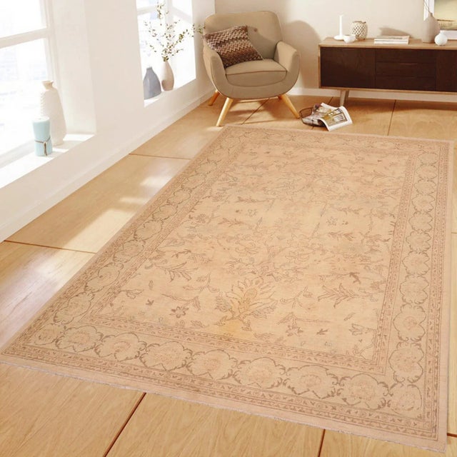 "Enhance the ambiance of your home with this magnificent Persian-influenced Turkish hand-knotted rug made by skilled...