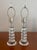 Beautiful pair of stacked lucite table lamps. In the manner of Karl Springer. Lucite bulbs stacked separated by black...