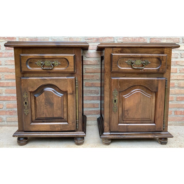 Charming pair of Spanish bedside cabinets crafted from wood, featuring a traditional and practical design. Each cabinet...