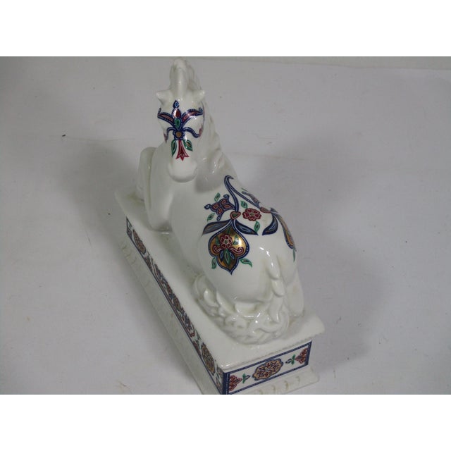 A wonderful porcelain box from the Elizabeth Arden Byzantium collection. It depicts a reclining horse on the lid. This...