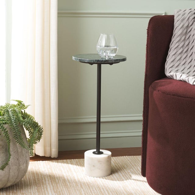 Introducing the Karik Round Side Table, a blend of elegance and functionality that enhances any space. Featuring a dark...