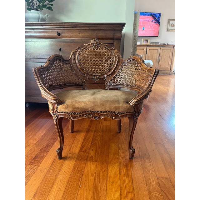 Rococo Revival Walnut Settee with Caned Back, 19th Century A magnificent parlor settee with elaborately hand-carved walnut...