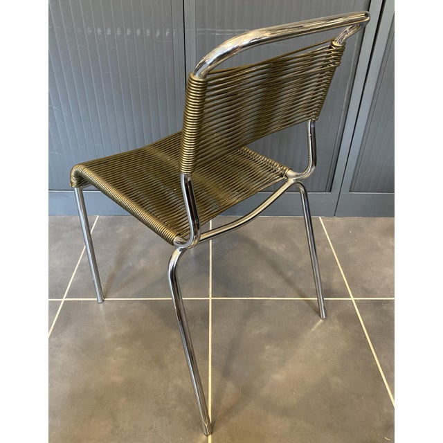 Chair in very good overall condition, with a very rare khaki green thread. Bright chrome with no pitting. Very comfortable...