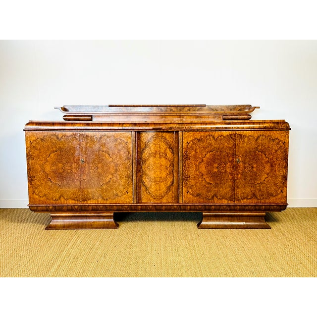 Spectacular art deco sideboard, made in france in the 1930s. this piece is distinguished by its superb burr walnut veneer...