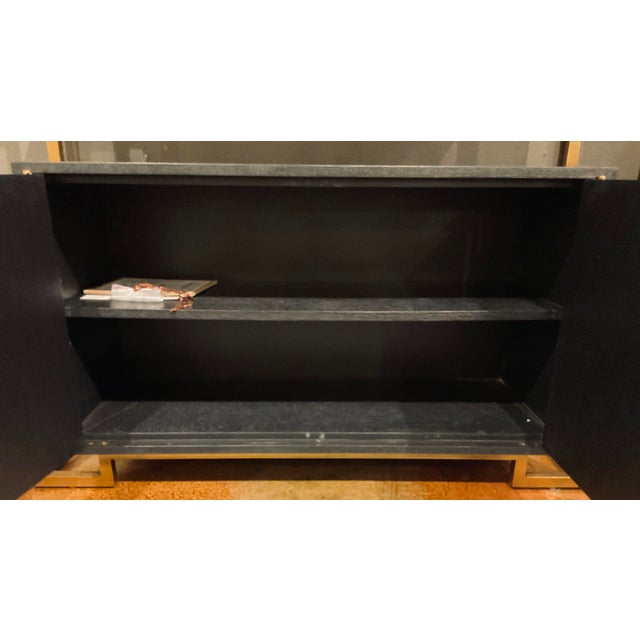 Original retail $14,645, stylish Jonathan Charles Modern Carrara Marble and Brass Fusion Etagere, black finished wood, two...