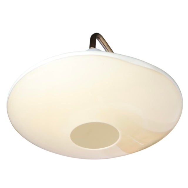 Mid Century wall mount swing arm, pull down sconce, designed by Gerald Thurston, for Lightolier, circa 1950/60's. The...