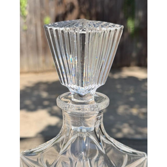 Elegant Crystal Clear Industries crystal decanter in the discontinued Monarch pattern. The Monarch pattern features a...