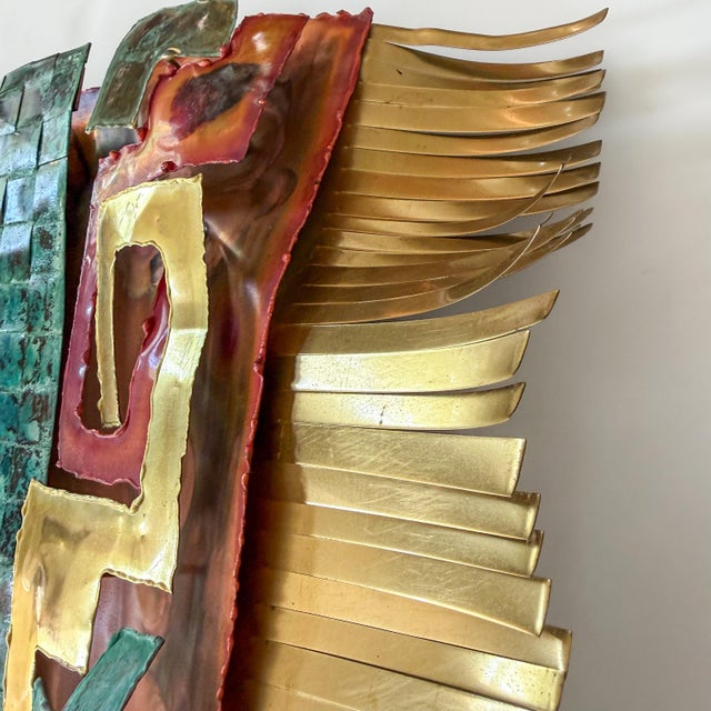 Signed and dated 2002 by Greg Gowen, this dimensional metal wall sculpture interprets a Southwestern woven rug through...
