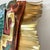 Signed and dated 2002 by Greg Gowen, this dimensional metal wall sculpture interprets a Southwestern woven rug through...