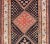 Measures: 4'9 x 9'2. This antique Persian Shiraz rug has been hand-knotted in wool and features a sub-geometric tribal...