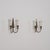 A distinctive and subtly playful pair of italian wall sconces from the 1950s, defined by a sculptural composition in brass...
