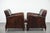 We are offering this distinctive set of two sleekly shaped sheepskin leather designer armchairs with beautiful deep colors...