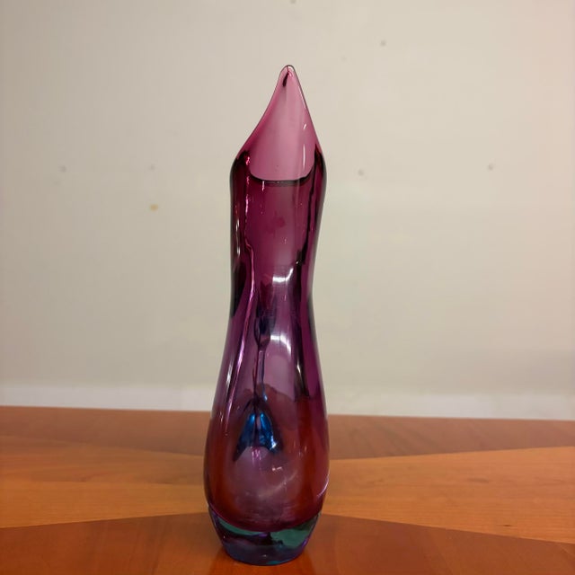 A sculptural Sommerso Murano art glass form with an elegant, flame-like silhouette and dramatic teardrop opening. The...