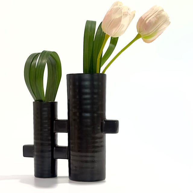 This striking piece is a Modernist Japanese Black Ceramic Ikebana Vase, renowned for its architectural silhouette and...