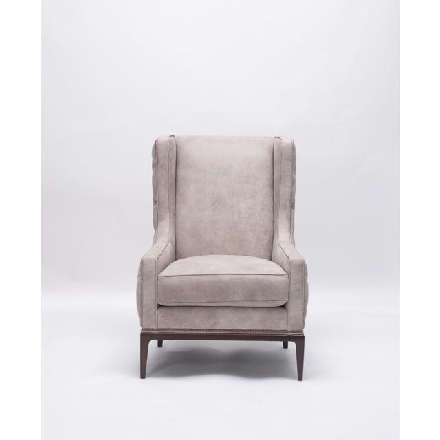 Lavender birch leather wing chair and ottoman. Button tufted outside back and wings with nailhead detail. Great new...