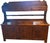 This hand chiseled pine bucket bench features three drawers and three doors. All drawers, doors and shelves are original...