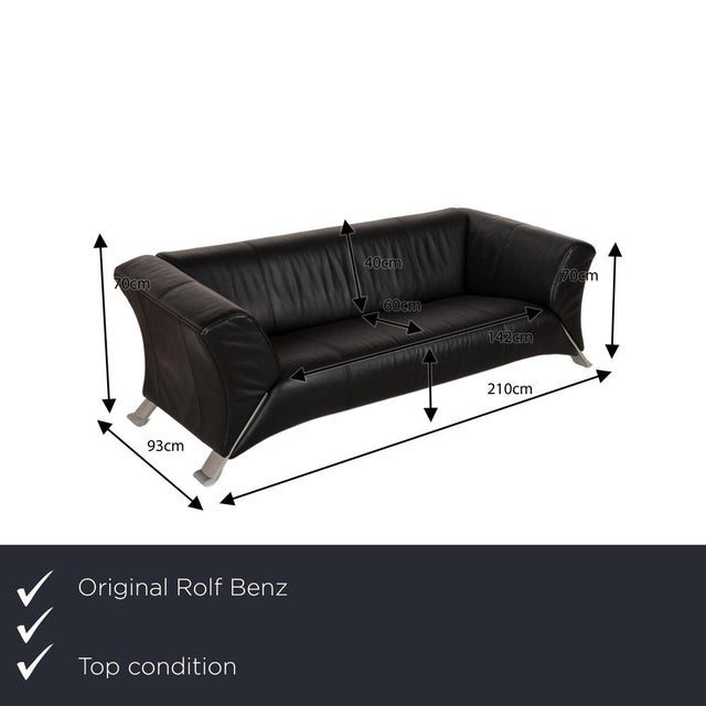 The 322 sofa by Rolf Benz is covered in black genuine leather and stands on silver metal feet. The modern design and the...