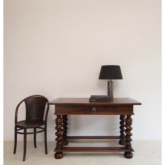A small French Louis XIII style table from the late 19th century. Crafted from solid walnut with a very beautiful original...