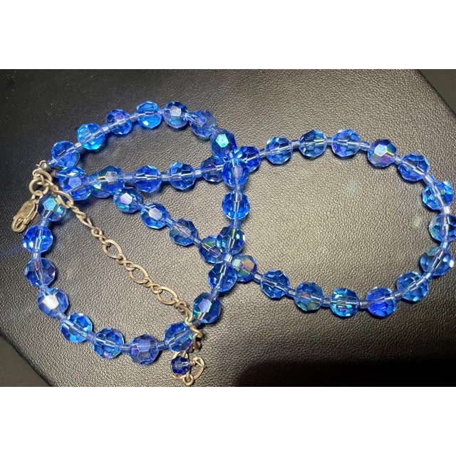 Swarovski Styled Leaded Crystal Cornflower Blue mid-century modern single-strand necklace shines with a dramatic Aurora...