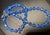 Swarovski Styled Leaded Crystal Cornflower Blue mid-century modern single-strand necklace shines with a dramatic Aurora...