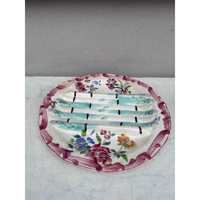 Majolica asparagus plate with flowers , signed Longchamp circa 1890.