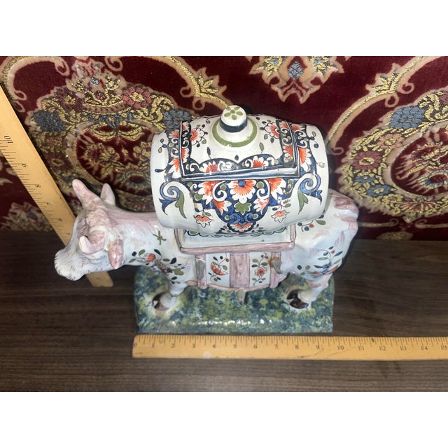 Beautifully aged hand painted mid century cow from France.