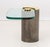 Karl Springer Sculptural End Table, with glass top and gilt and gunmetal-tone brass cylindrical base. 18.25" H x 24" W x...