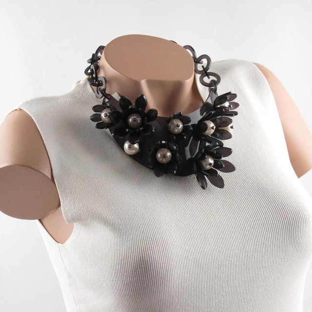 This impressive transparent anthracite gray Lucite or acrylic resin bib choker necklace was crafted by Italian designer...