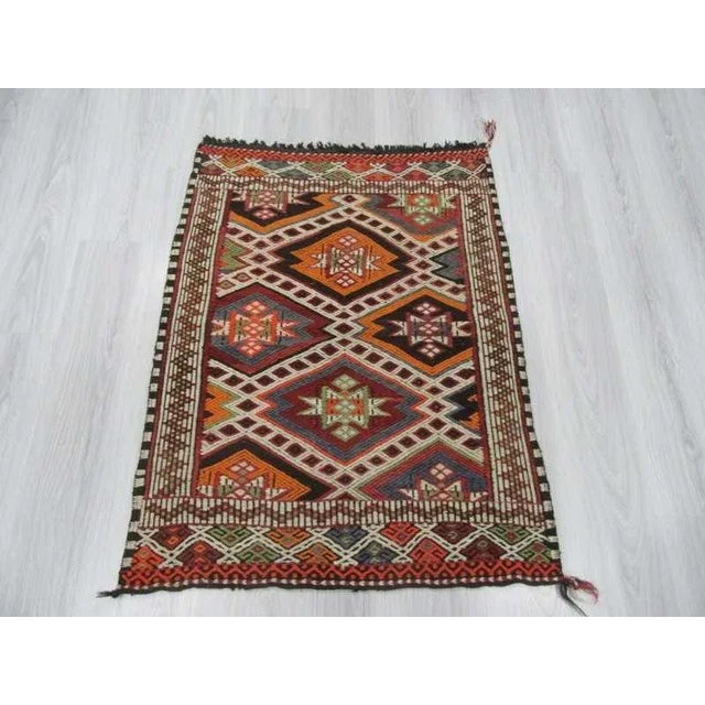 Vintage embroidered small kilim rug from Mut region of Turkey. Approximately 35-45 years old and in good condition.