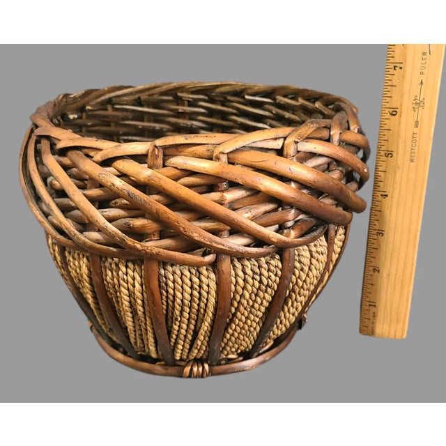 Add a rustic touch to your home decor with this vintage oval basket. Handmade with a mix of bamboo and rope materials,...