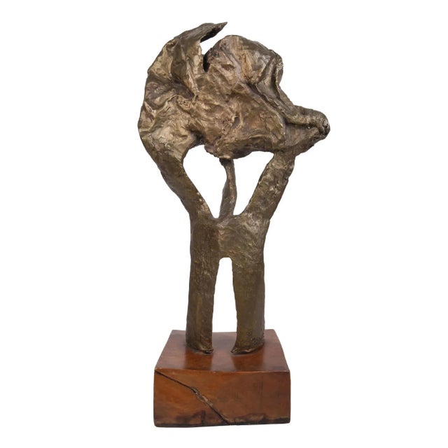 Bronze sculpture on a wood base by Carrie Abramowitz (American 1913-1999). Abstract bronze sculpture of a bird signed and...