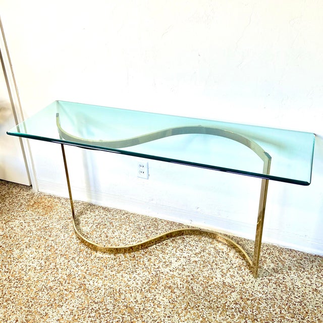 Vintage table with a sleek modern look, reminiscent of pieces by Maison Jansen and Karl Springer. It consists of two...