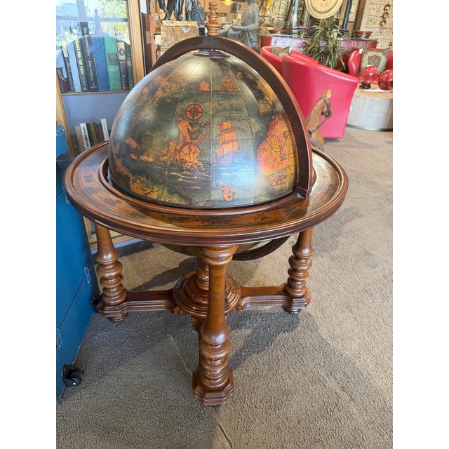 Bring old-world charm and functional elegance to your space with this stunning large globe bar cabinet, a statement piece...