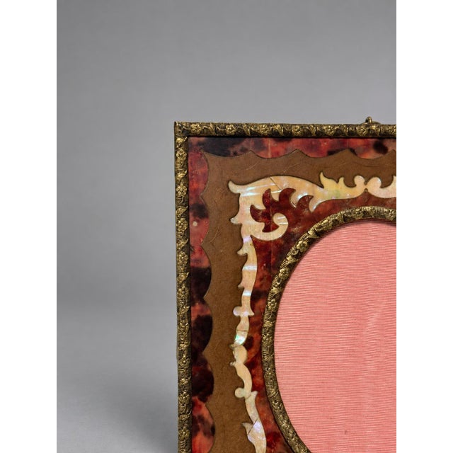 A fine pair of small decorative tabletop or wall hanging picture frames in the Napoleon III or late Victorian Boulle...