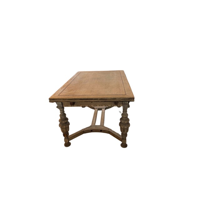 The Antique Jacobean Extendable Dining Table is a stylish and functional piece for your dining room. Made of oak with a...