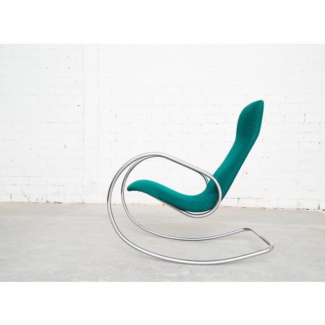 A delicate rocking chair by the German architect and designer Ulrich Böhme, dating from 1971. Upholstered in green...