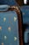 Antique French Louis XVI style bergère armchair. Carved detail with blue floral upholstery.