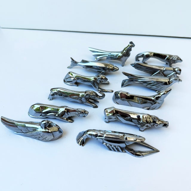 A delightful set of twelve Art Deco silver-plated figural knife rests, crafted in the manner of Christofle, France, 20th...