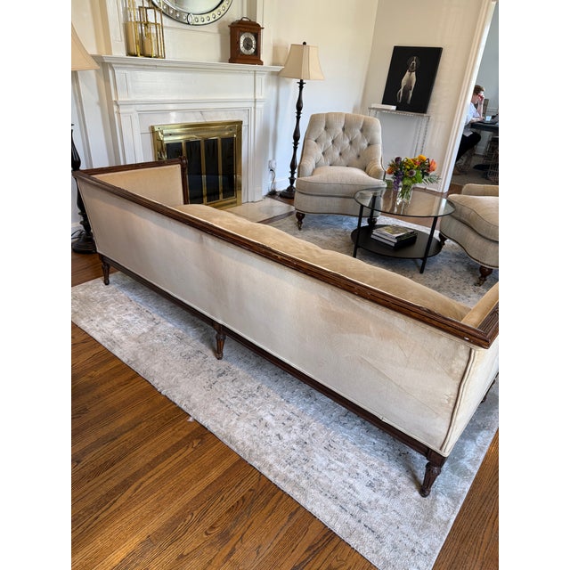 Vintage Louis XVI style wood framed sofa by Meyer Gunther Martini upholstered in a light sand velveteen fabric. The single...