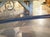 A French 1970s Wrought Iron and Brass Dining Table With Smoked Glass Top For Sale - Image 4 of 18