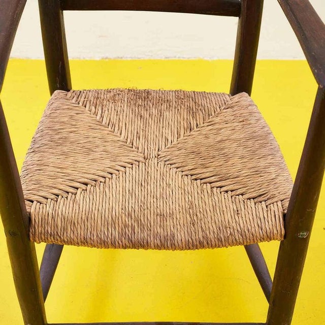 This refined straw armchair from the early 1900s is a perfect example of craftsmanship, combining functionality and...