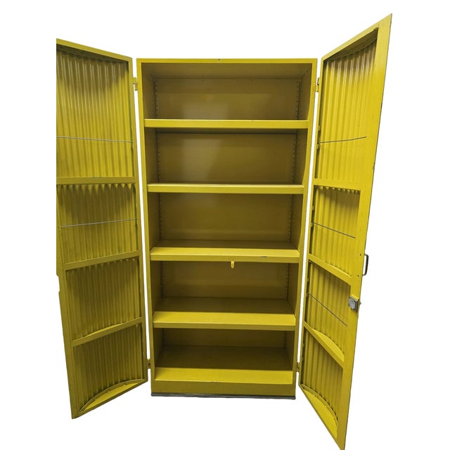 Designer industrial cabinet produced in Eastern Europe during the 1970s. Constructed from lacquered metal with distinctive...